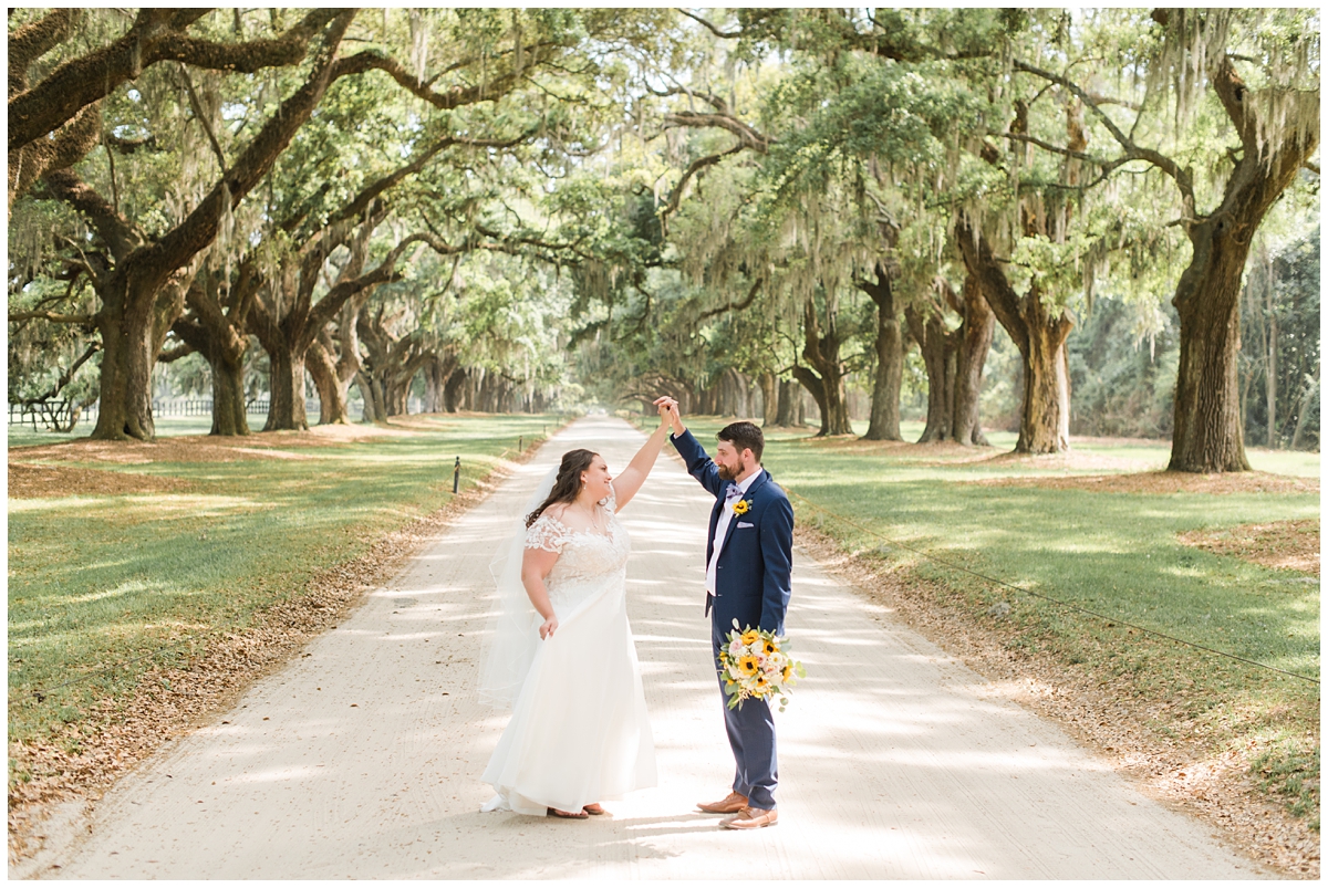 groom twirls bride in Charleston SC